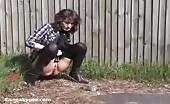 Sexy babe peeing behind a tree