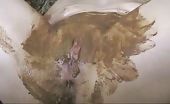 Smearing brown shit on naked body