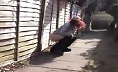 Teen redhead peeing in an alley