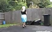 Busty blonde peeing on wooden bench