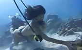 Two girls shitting underwater