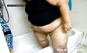 Fat American brunette shitting in bathtub