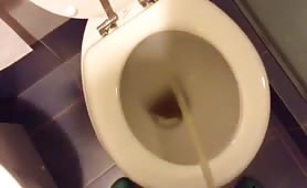 Italian teen boy peeing in the toilet