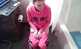 Sexy teen undressed to take a shit in the toilet