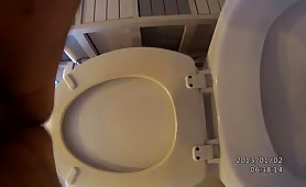 Long brown turd over the toilet with a teen boy