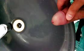 Peeing in a black sink