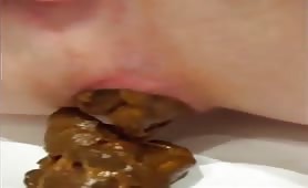 Hot babe shitting in close up