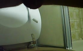 Liquid shit over the toilet