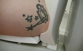 Tattooed girl pooping