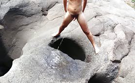 Pooping and pissing in a natural hole