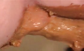 Hardcore anal sex with shit on the toy cock