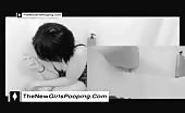 Young brunette shitting in toilet