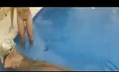 Two girls poop together in the pool
