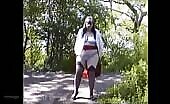 Skirt drops to reveal thong in woods