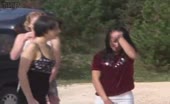 Women squatting and pissing on sand outdoors