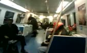 Man squats on train floor and drops thick turd